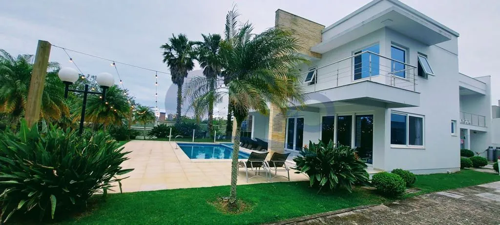 Imagem Casa a venda com 4 dormitorios no Igra Norte em Torres/RS