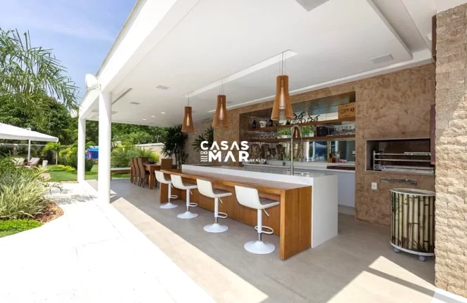 Imagem Imponente mansão de luxo na Barra da Tijúca: 5 quartos, 4 suítes, 3 salas, 7 banheiros, 2 vagas de garagem, 920m² de área. Venda!