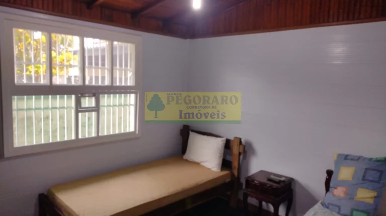 Imagem Imperdível Casa de 4 Quartos na Prainha, Caraguatatuba-SP: 2 Suítes, 2 Salas, 4 Banheiros, 4 Vagas de Garagem!