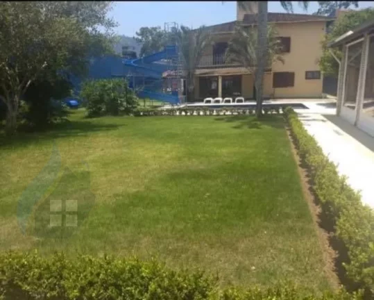 Imagem Casa de 7 dormitórios, 4 suíte, 6 banheiros e 2 vagas, com 327,695m² construída e 1.047,75m² total em Centervalle, Bertioga