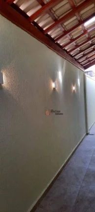Imagem Casa com 2 dormitórios à venda, 110 m² por R$ 585.000,00 - Maracanã - Praia Grande/SP
