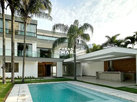 Imagem Imponente residência de luxo com 4 suítes na Barra da Tijúca, Rio de Janeiro - RJ: 3 salas, 6 vagas e 1.000m² de puro requinte!