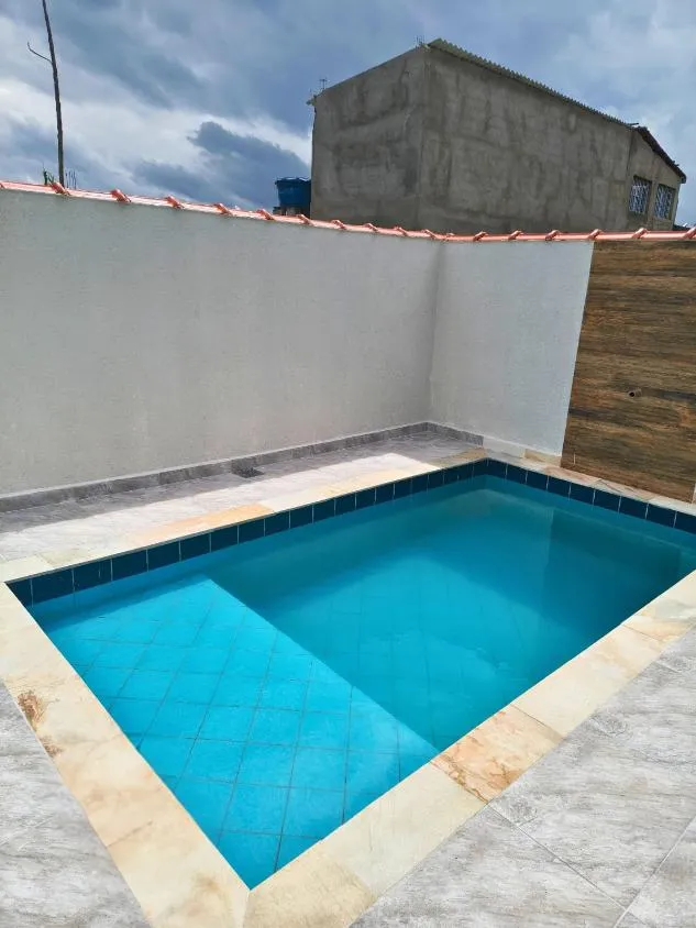 Foto do imóvel CASA NOVA COM PISCINA LADO PRAIA 2 DORM A VENDA EM ITANHAEM FINANCIAMENTO BANCARIO