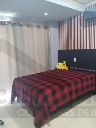 Imagem CASAL IMÓVEIS VENDE CASA PORTEIRA FECHADA MORADE VERDE 5 SUÍTES + ENERGIA SOLAR