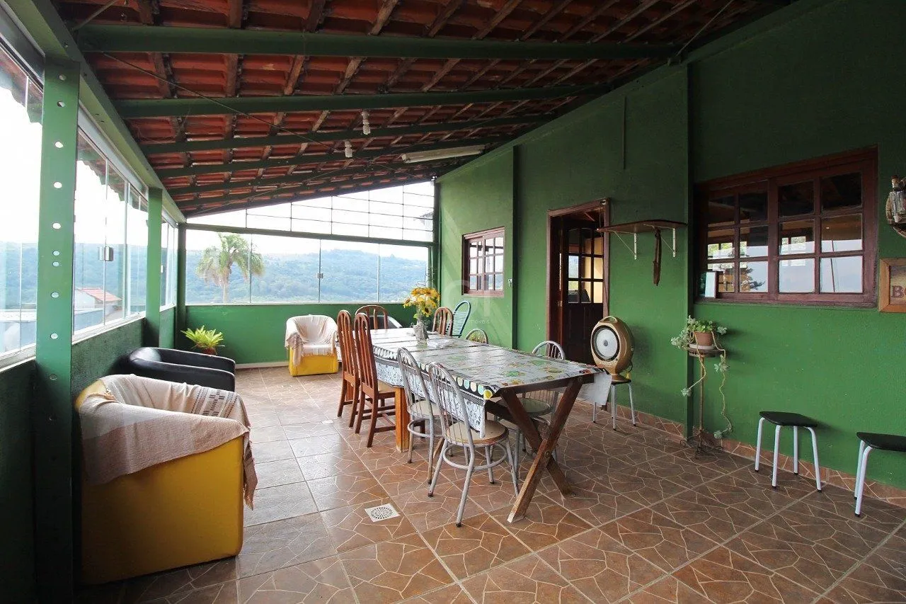 Imagem Casa para Venda - 339m², 3 dormitórios, 2 vagas - Vila Nova, Porto Alegre