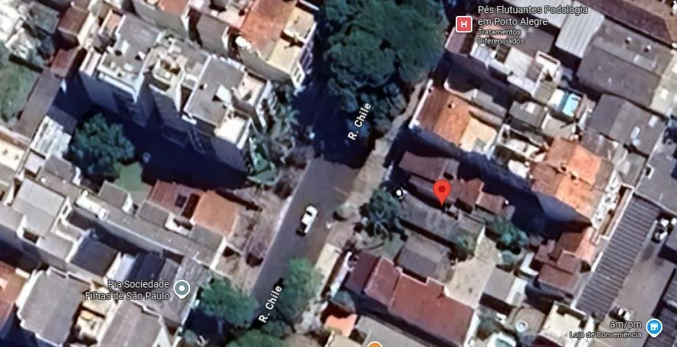 Imagem terreno com casa pequena