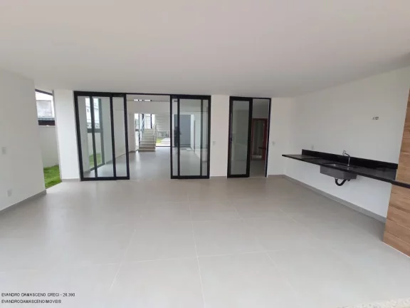 Imagem Luxuosa casa em condomínio à venda em Lauro de Freitas-BA, no bairro Buraquinho, com 4 quartos, 4 suítes, 2 salas, 1 banheiro, 2 vagas de garagem e 350m² de área.