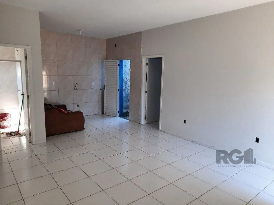 Imagem Oportunidade Imperdível: Prédio com 4 Apartamentos, Pátio e 2 Vagas de Garagem