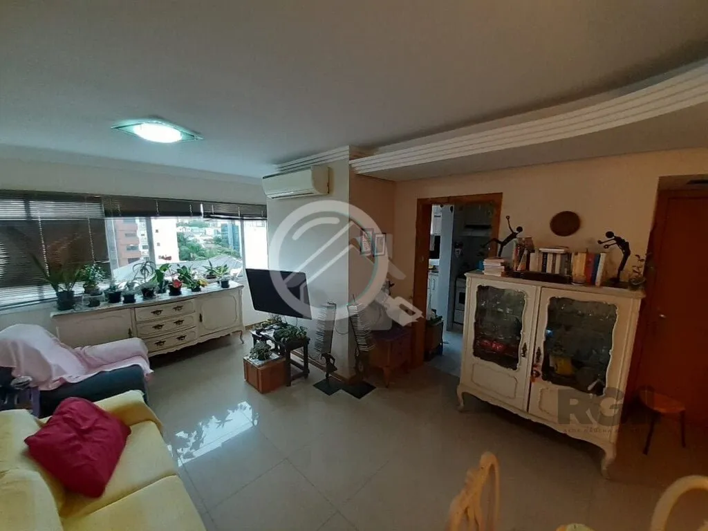 Imagem Apartamento de dois dormitórios sendo um suíte, living dois ambientes com churrasqueira, cozinha e...