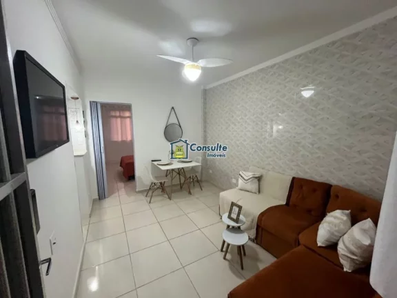 Imagem "Viva a experiência de morar pertinho da areia, em um apartamento aconchegante de 1 dormitório, porteira fechada, situado a poucos passos da praia, com uma vista lateral encantadora do mar que torna cada dia mais especial." Por apenas R$ 270.000,00. Agend