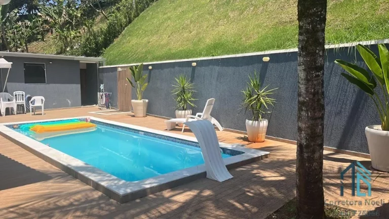 Imagem Casa em Condomínio a venda, 04 quartos sendo duas suítes, piscina em Cajati SP