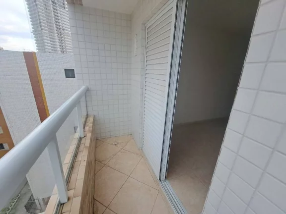 Imagem Apartamento com 2 dormitórios à venda, 56 m² por R$ 320.000 - Caiçara - Praia Grande/SP