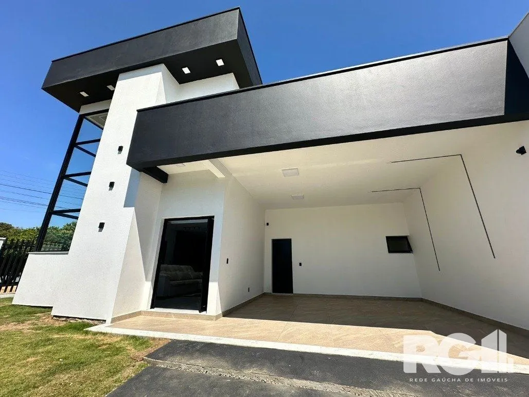 Imagem Casa de alto padrão a venda, totalmente mobiliada, com 2 dormitórios, 1 suite e 2 vagas no centro de Nova Santa Rita.