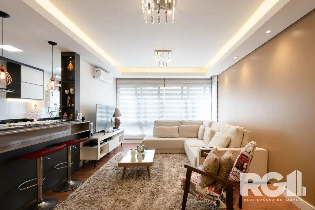 Imagem Apartamento de 3 dormitórios com suíte e churrasqueira, lavabo e 2 vagas de garagem.