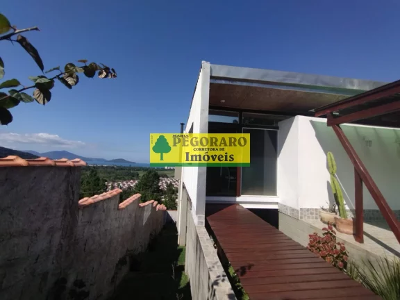 Imagem Casa à venda em Caraguatatuba-SP: 3 quartos, suíte, sala com vista para o mar e deck com hidro!