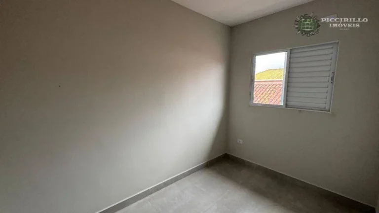 Imagem Sobrado com 2 dormitórios à venda, 49 m² por R$ 350.000 - Maracanã - Praia Grande/SP