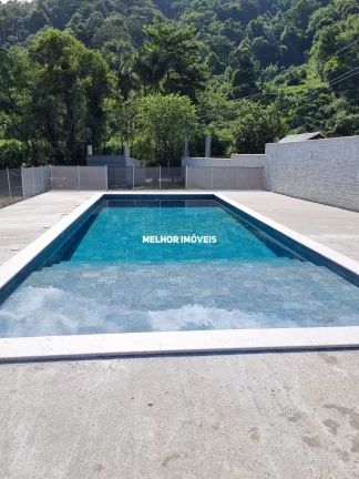 Imagem Chácara á venda com 2 casas, piscina, salão de festa localizada em Camboriú Santa Catarina
