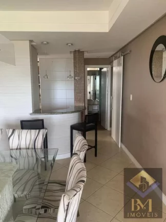 Imagem APARTAMENTO NO BOQUEIRÃO FRENTE MAR COM VARANDA E PORTEIRA F