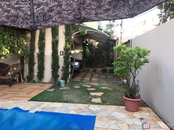 Imagem Casa de Alto Padrão no Bairro Sobradinho em Patos de Minas – 4 Quartos, Suíte com Hidromassagem e Garagem para 4 Carros!