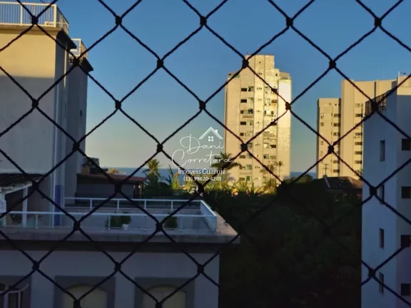 Imagem Imperdível! Apartamento de 2 quartos com suíte e 2 vagas de garagem em Pitangueiras, Guarujá-SP - 78m² de conforto e elegância!