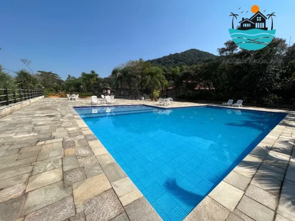 Imagem Alugar casa Juquehy - Casa em Condomínio 4 dormitórios, 3 suítes, 4 vagas, serviço e apoio de praia privativo - máx. 10 pessoas | Juquehy Imobiliária.