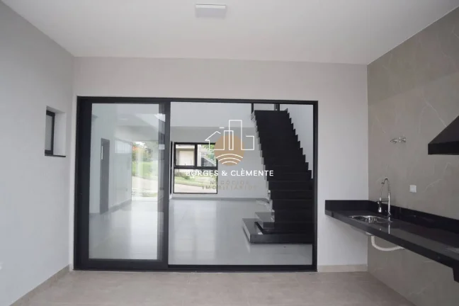 Imagem Casa com 4 Suítes e Design Moderno em condomínio