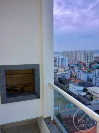 Imagem Vendo apartamento em Bairro Arreias São José SC, de três dormitórios, suíte, duas vagas livres, cozinha e área de serviço mobiliados.