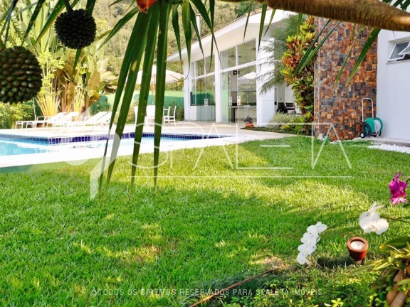 Imagem Oásis de Luxo: Casa térrea com piscina, sauna e píer privativo à venda no condomínio Marina Guarujá