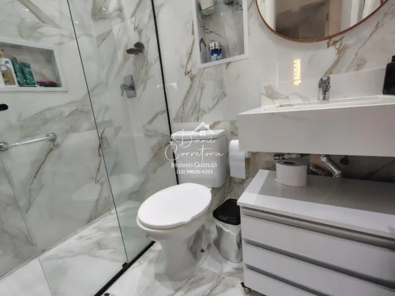 Imagem Imperdível! Apartamento de 2 quartos com suíte e 2 vagas de garagem em Pitangueiras, Guarujá-SP - 78m² de conforto e elegância!