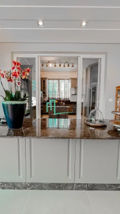 Imagem Magnifica casa com projeto arquitetônico diferenciado e exclusivo em um lote de esquina com 1.050 metros em um dos condominios mais valorizados e proc