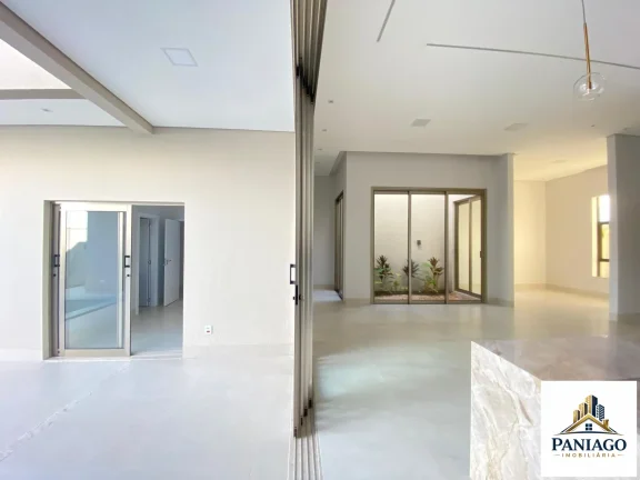 Imagem Casa de alto padrão com 3 suítes, cozinha gourmet e piscina com cascata