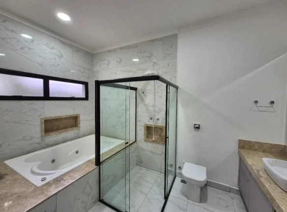 Imagem Imperdível oportunidade de adquirir casa de luxo em Votorantim-SP, no Alphaville Nova Esplanada 3, com 4 quartos, 3 suítes, 4 vagas de garagem e 204,10 m² de área.