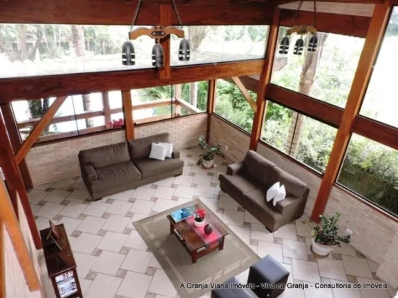 Imagem Muita privacidade com paisagismo tropical, piscina, 5 dormitórios e área gourmet completa.