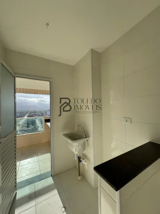 Imagem Apartamento de 2 dormitórios sendo 1 suíte, prédio frente mar no bairro Vila Mirim - Praia Grande