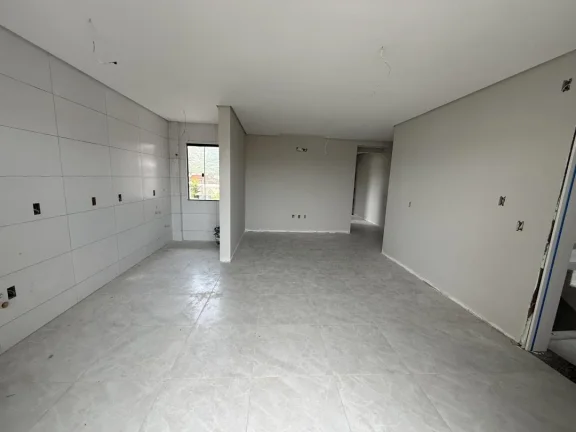 Imagem Apartamento de dois dormitórios, sendo uma suíte, sacada com churrasqueira e uma vaga de garagem no bairro de Gravatá, em Navegantes - Adriano Carpes imóveis vende