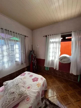 Imagem Terreno com 566,50 m² e casa no Centro de Porto Belo
