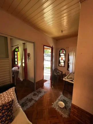 Imagem Terreno com 566,50 m² e casa no Centro de Porto Belo