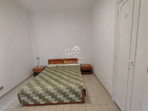 Imagem Imperdível! Apartamento de 3 quartos com suíte e 2 salas em Pitangueiras, Guarujá-SP. 100m² de conforto e elegância.