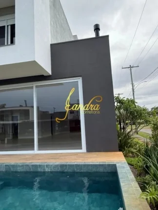 Imagem Sobrado condomínio fechado com 05 suítes e piscina beira lago