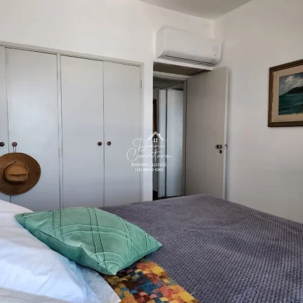 Imagem Apartamento com vista para o oceano no Morro do Maluf em Guarujá-SP: 3 quartos, 1 suíte, 2 salas, 3 banheiros, 1 vaga, 128m².