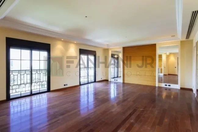 Imagem Com uma área privativa de 315m2, este apartamento luxuoso conta com um espaçoso living para três ambientes, sala de jantar e sala de almoço, além de u