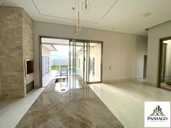 Imagem Casa de alto padrão com 3 suítes, cozinha gourmet e piscina com cascata