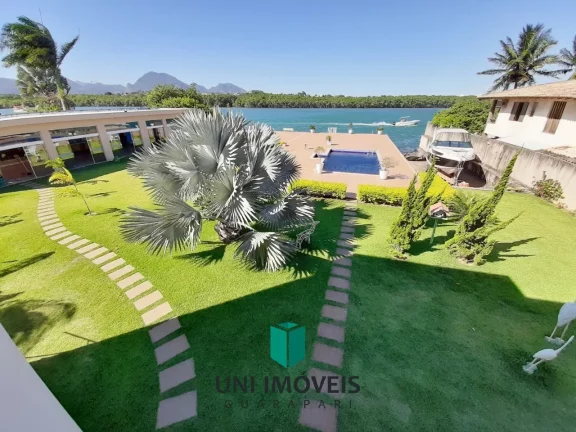 Imagem Mansão de luxo à venda no Canal de Guarapari com marina privativa, 5 suítes e lazer completo