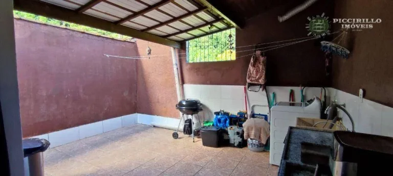 Imagem Sobrado com 3 dormitórios à venda, 118 m² por R$ 680.000,00 - Canto do Forte - Praia Grande/SP