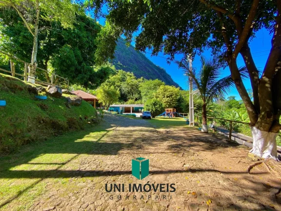 Imagem Chácara com 10 suítes e Cachoeira a venda, 9.104M² na zona rural de Guarapari.