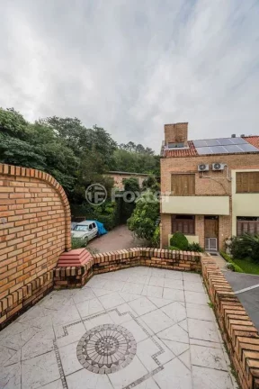 Imagem Casa em Condomínio 3 dorms à venda Avenida Vicente Monteggia, Cavalhada - Porto Alegre