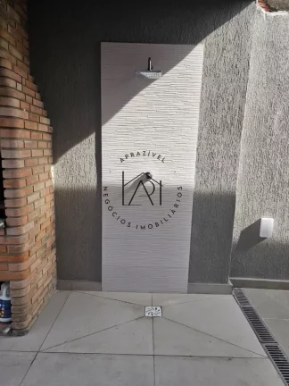Imagem Casa para Venda em Praia Grande, Mirim, 2 dormitórios, 1 suíte, 3 banheiros, 3 vagas