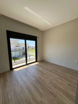 Imagem Casa alto padrão em condomínio com 4 suítes e 4 vagas de garagem em Camboriú/SC