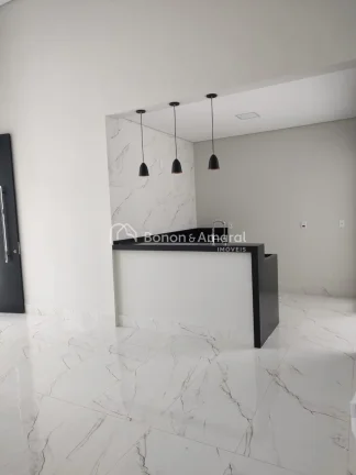 Imagem Esta casa térrea de 166 metros quadrados é uma joia de elegância e conforto. Com três quartos, s...