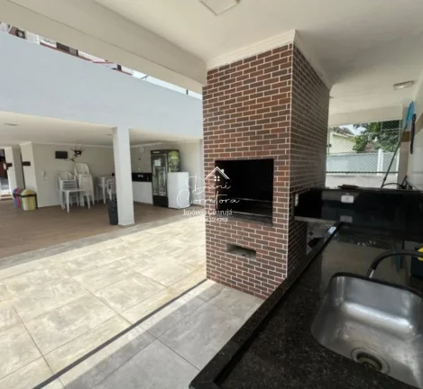 Imagem Aluguel de apartamento no Jardim Astúrias, Guarujá-SP: 2 quartos, 1 suíte, 2 salas, 2 banheiros, 1 vaga de garagem, 85m² de área.